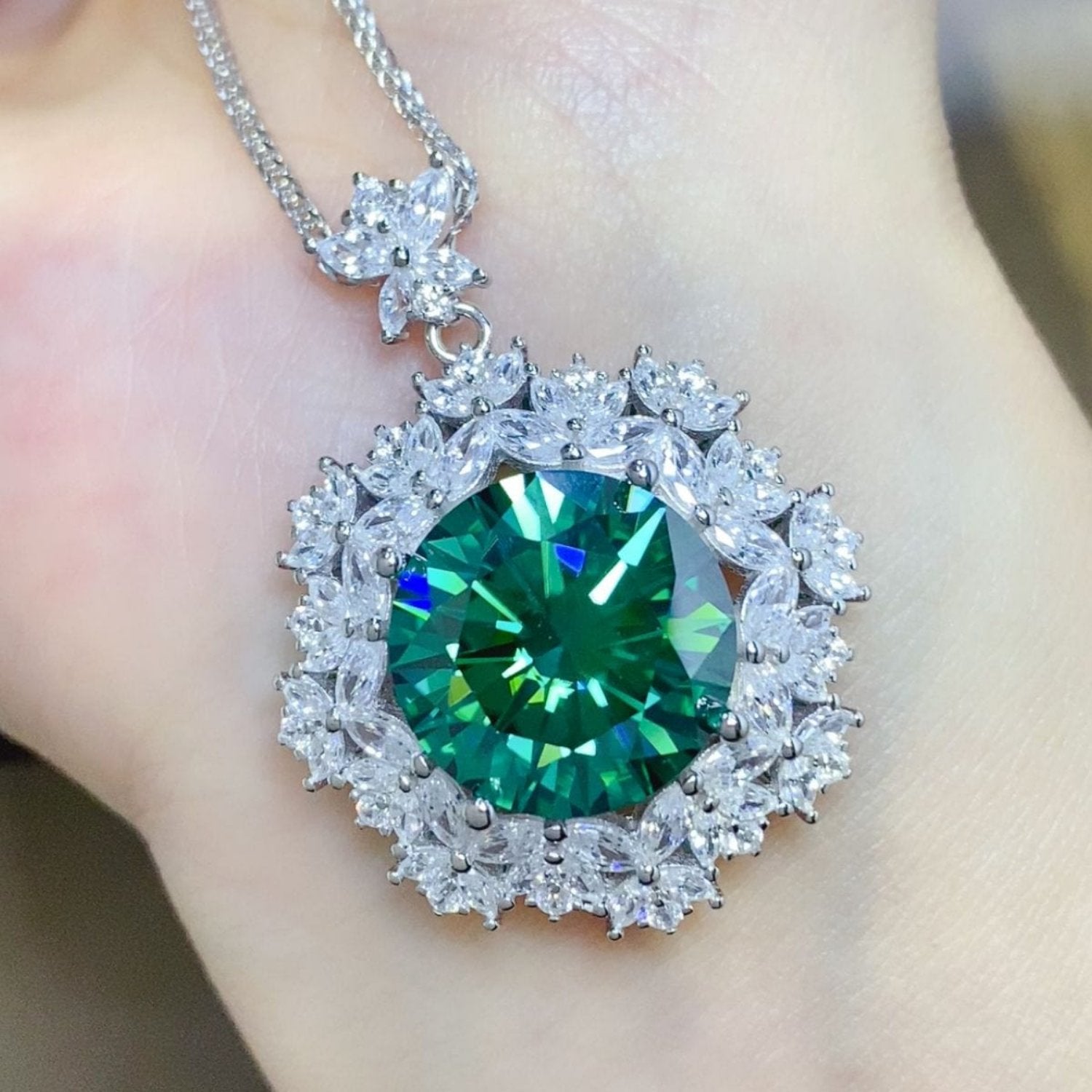 shining diamond white around a green shining stone with flecks of blue's and green's